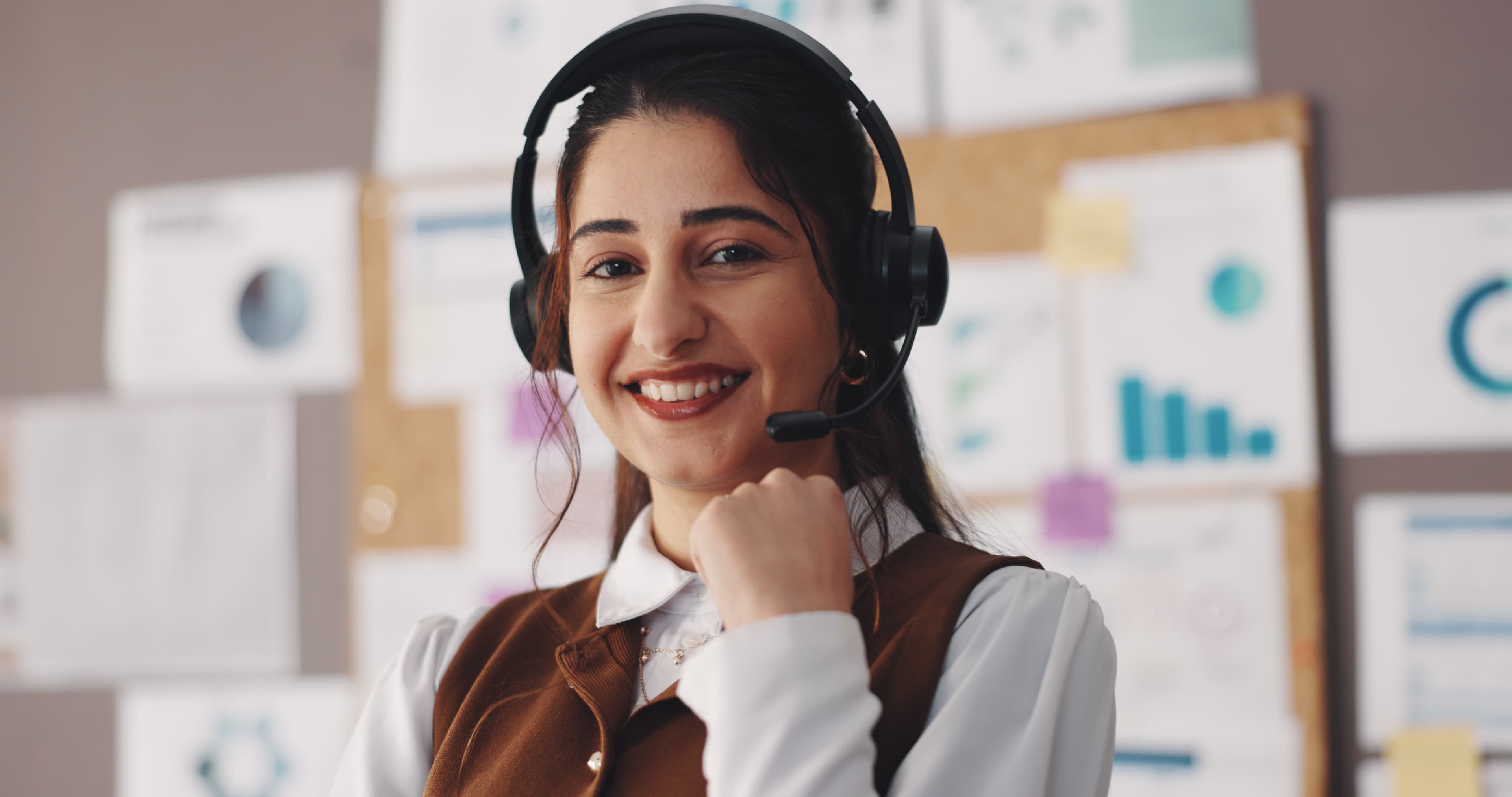 Support specialist with a headset, ready to help